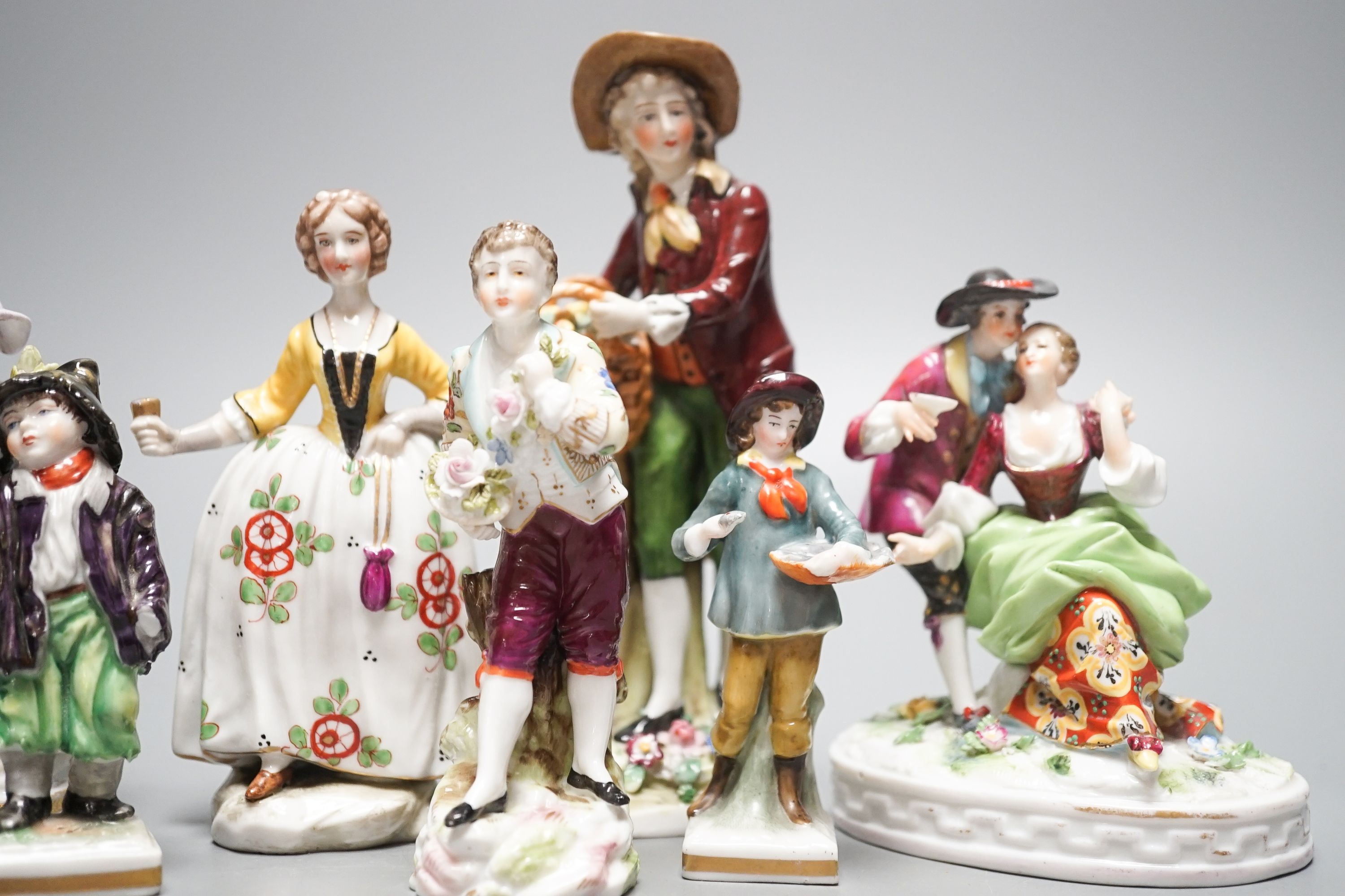 A collection of German porcelain figures, two by Sitzendorf, tallest 15.5 cm